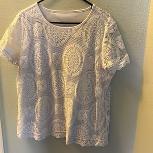 Women’s white shirt sleeve top with white polyester lining and lacy overlay